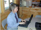 Janee uploading her website at the campground at Palmyra Maine